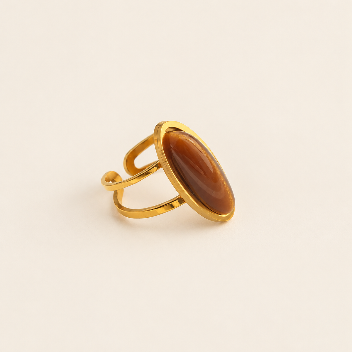 Oval Amber Ring — warm ivory background