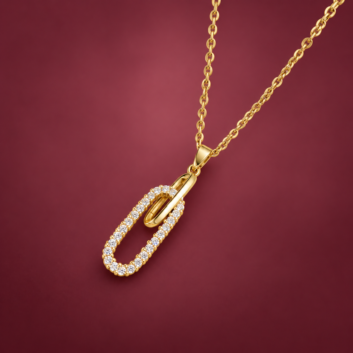 Crystal Oval Pendant Necklace — muted burgundy background