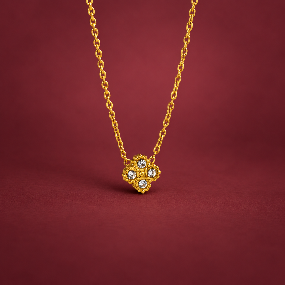 Crystal Flower Pendant Necklace — muted burgundy background