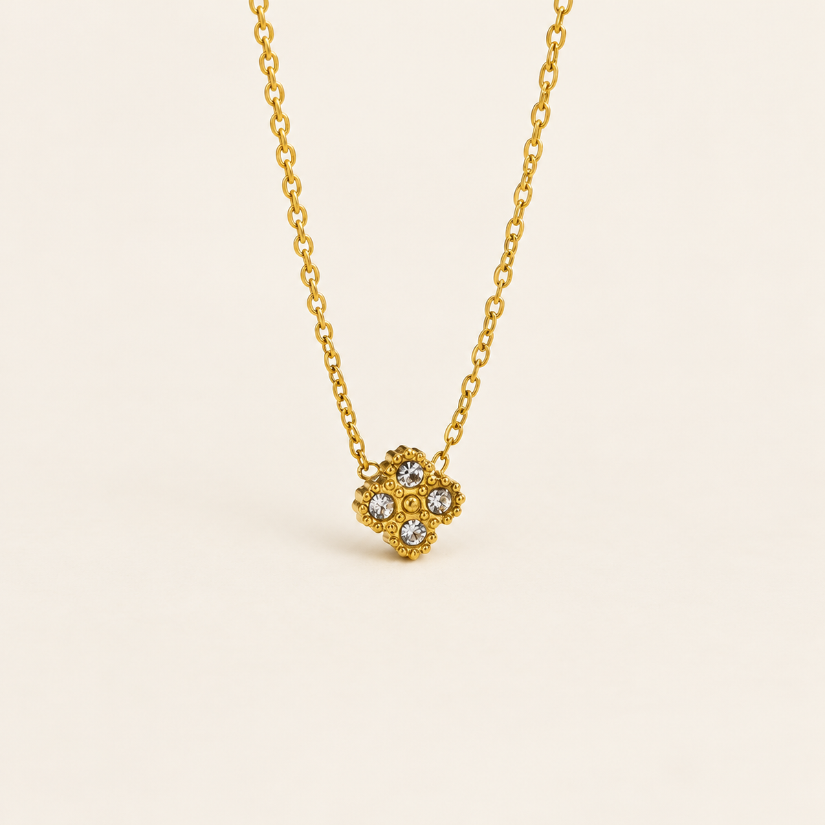 Crystal Flower Pendant Necklace — warm ivory background