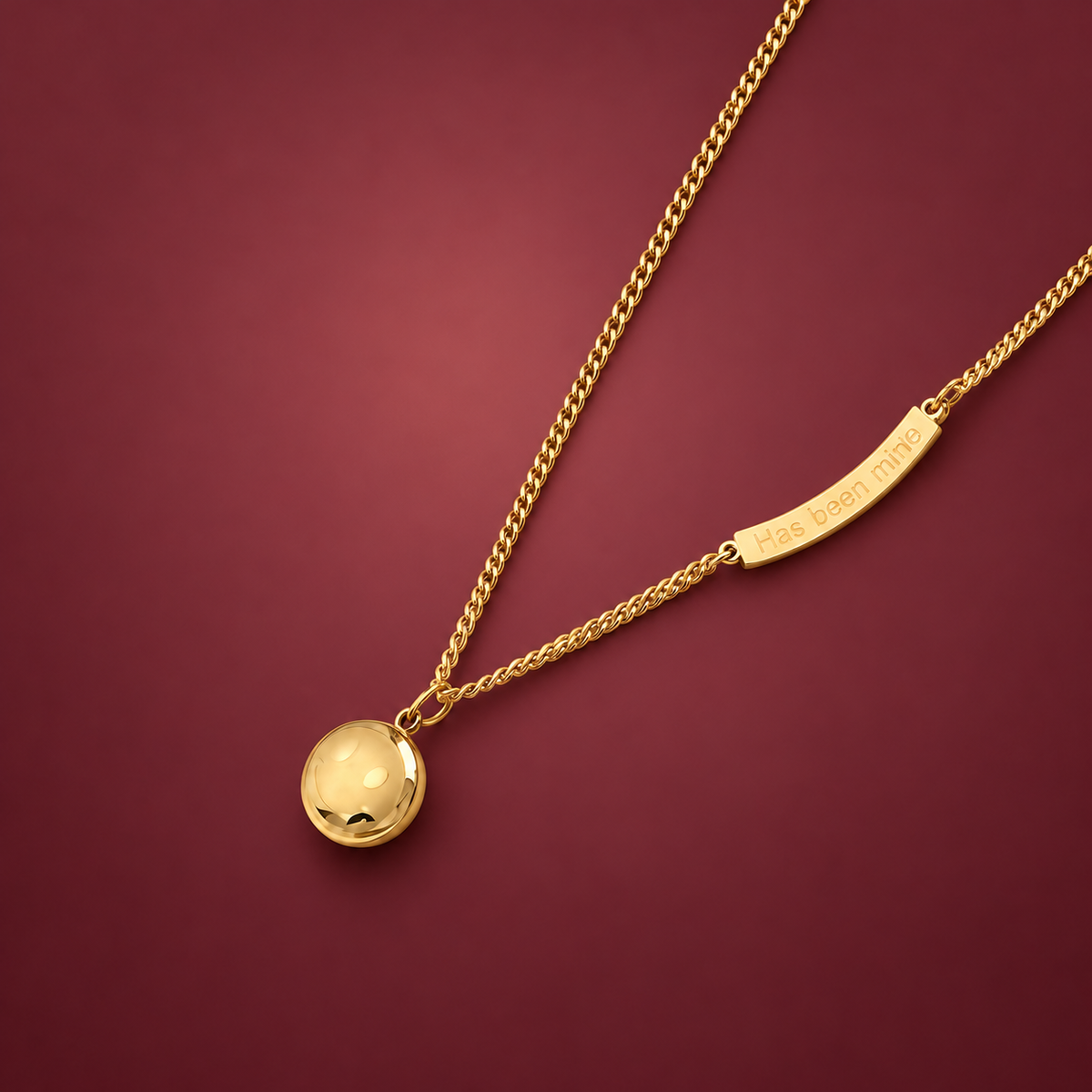 Moon and Disc Necklace — muted burgundy background