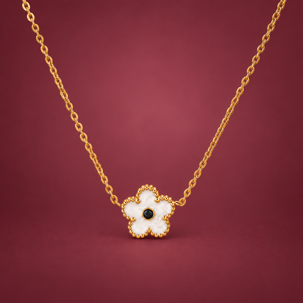 White Flower Necklace — muted burgundy background