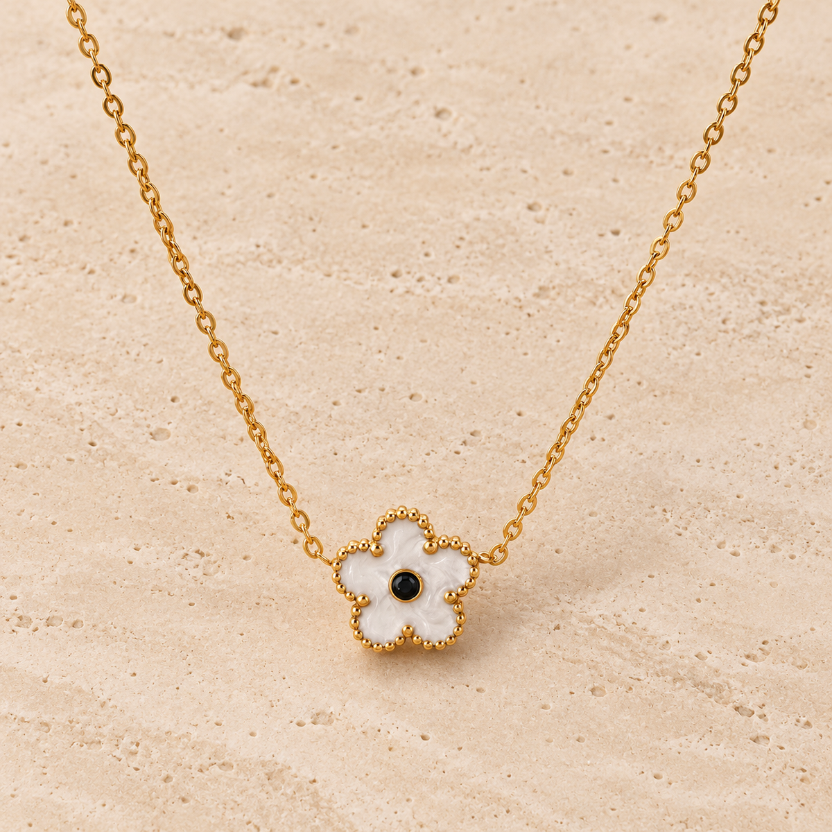 White Flower Necklace — pale beige natural stone background