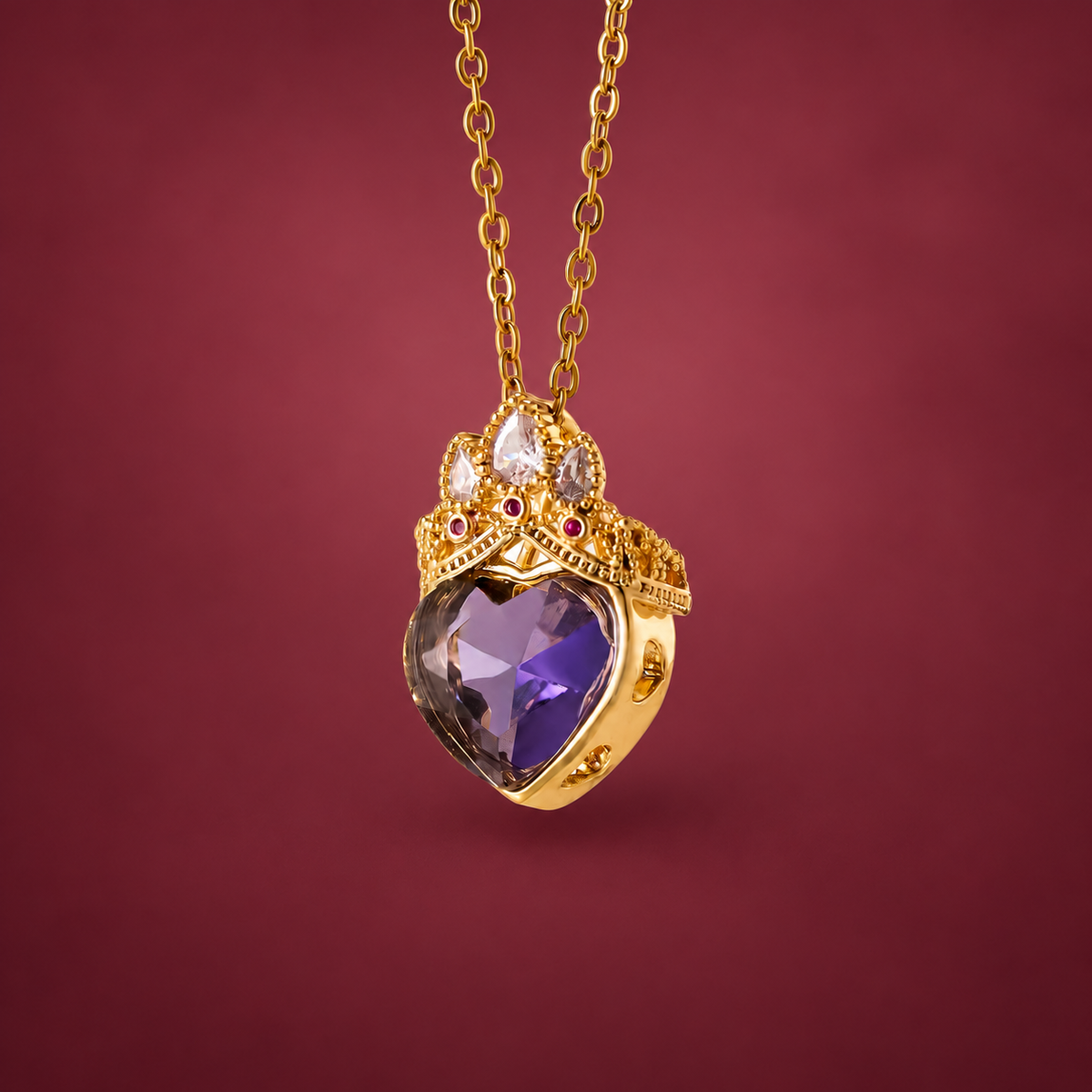 Purple Crown Heart Necklace — muted burgundy background