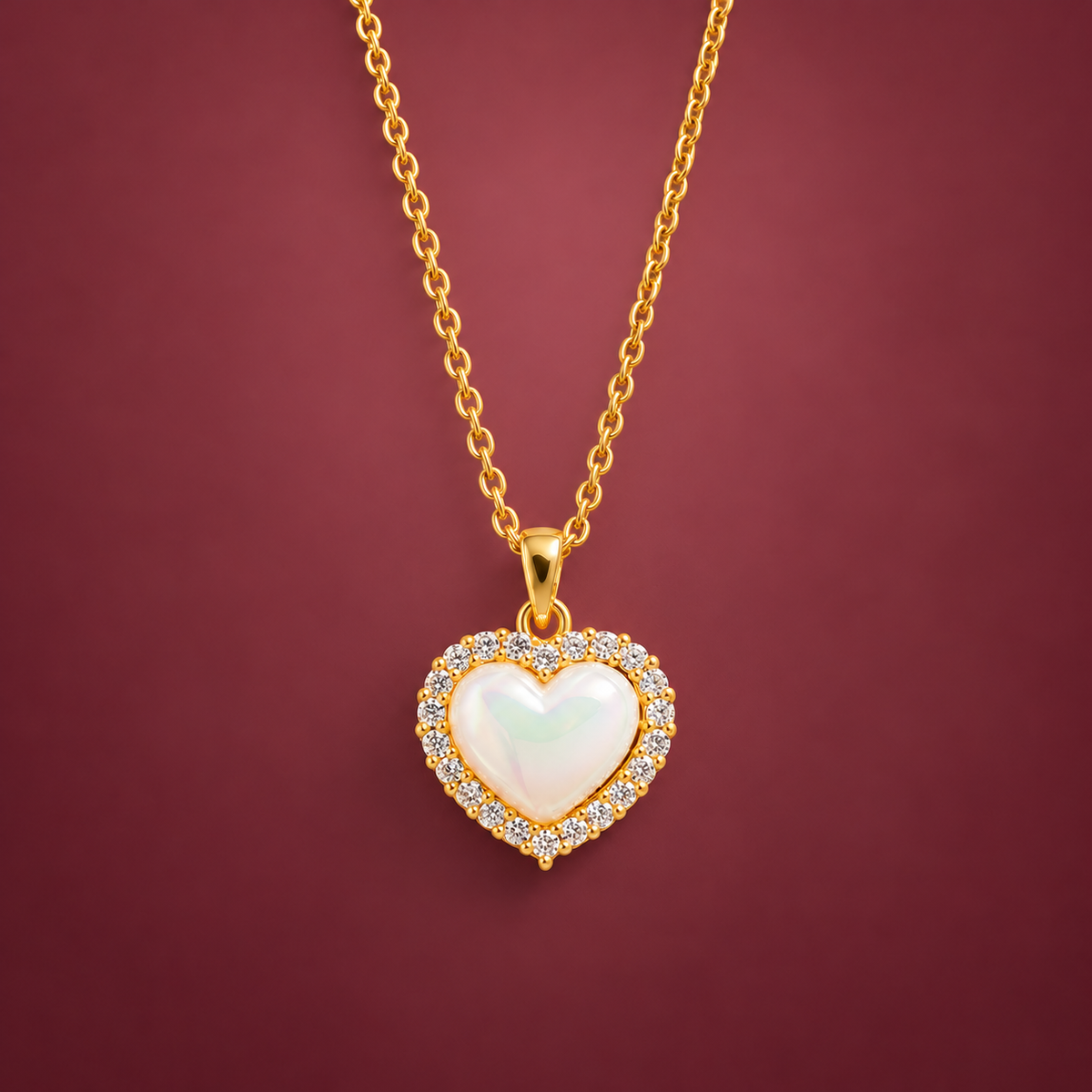 Pearlescent Heart Necklace — muted burgundy background