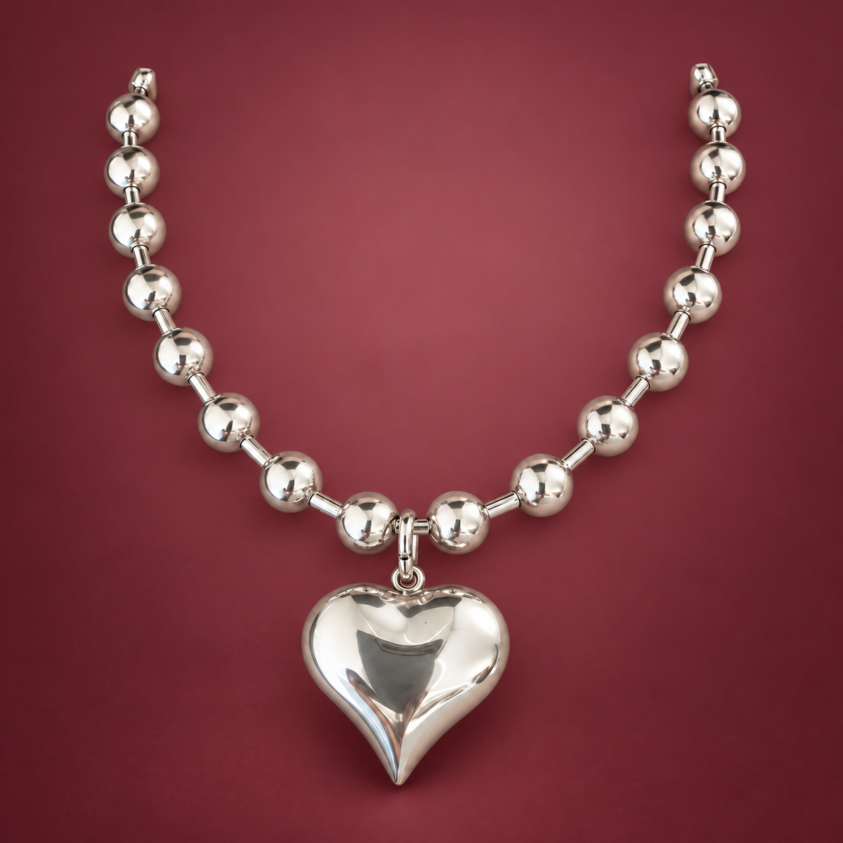 Silver-Tone Heart Ball Chain Necklace — muted burgundy background