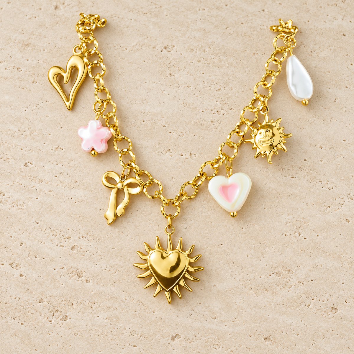 Gold Charm Chain Necklace — pale beige natural stone background