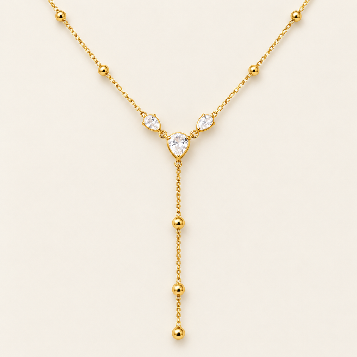 Crystal Heart Y Necklace — warm ivory background