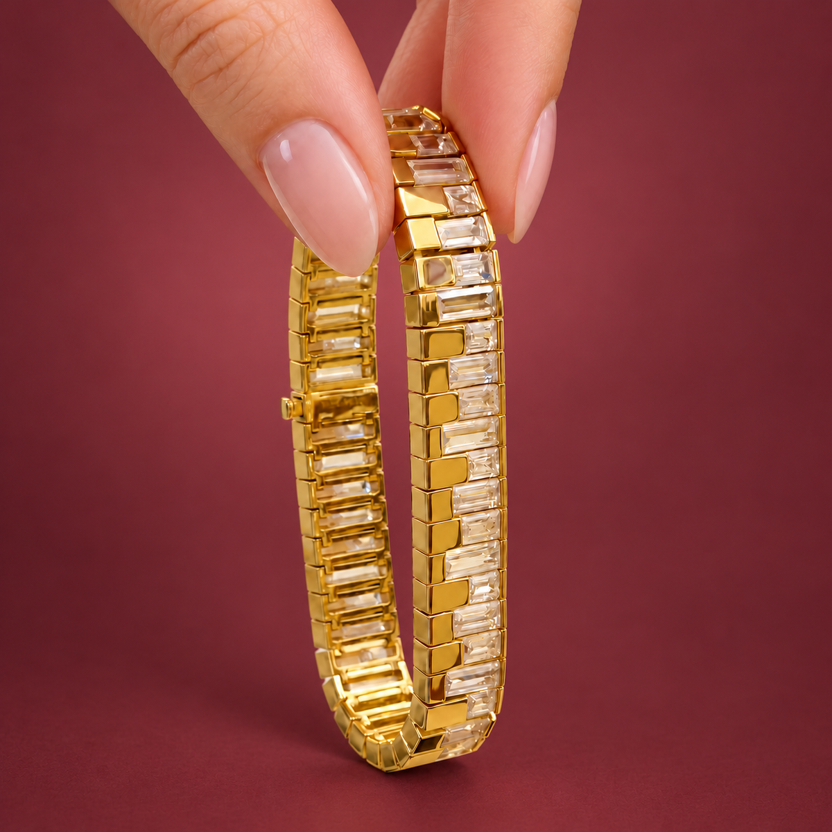 Gold-Tone Rectangle Link Bracelet — muted burgundy background