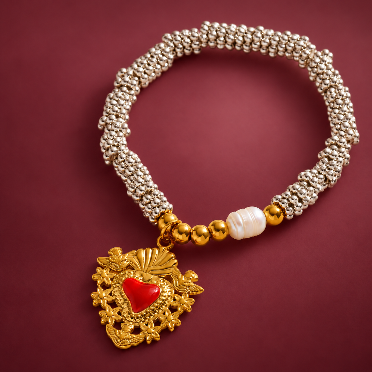 Red Heart Bead Bracelet — muted burgundy background