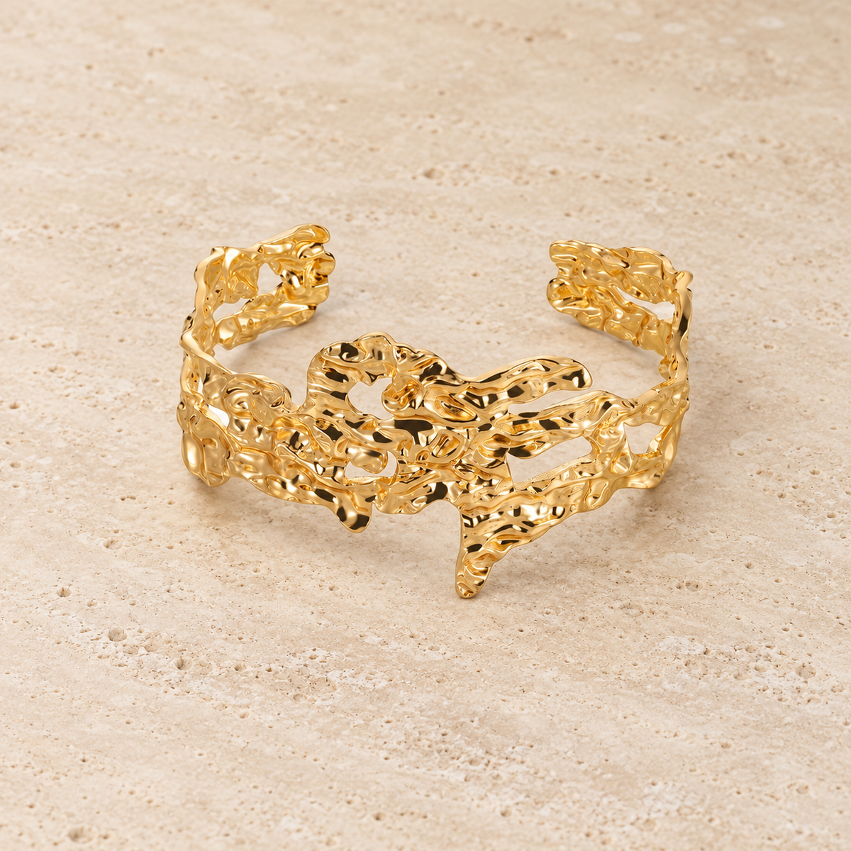 Sculpted Leopard Cuff — pale beige natural stone background