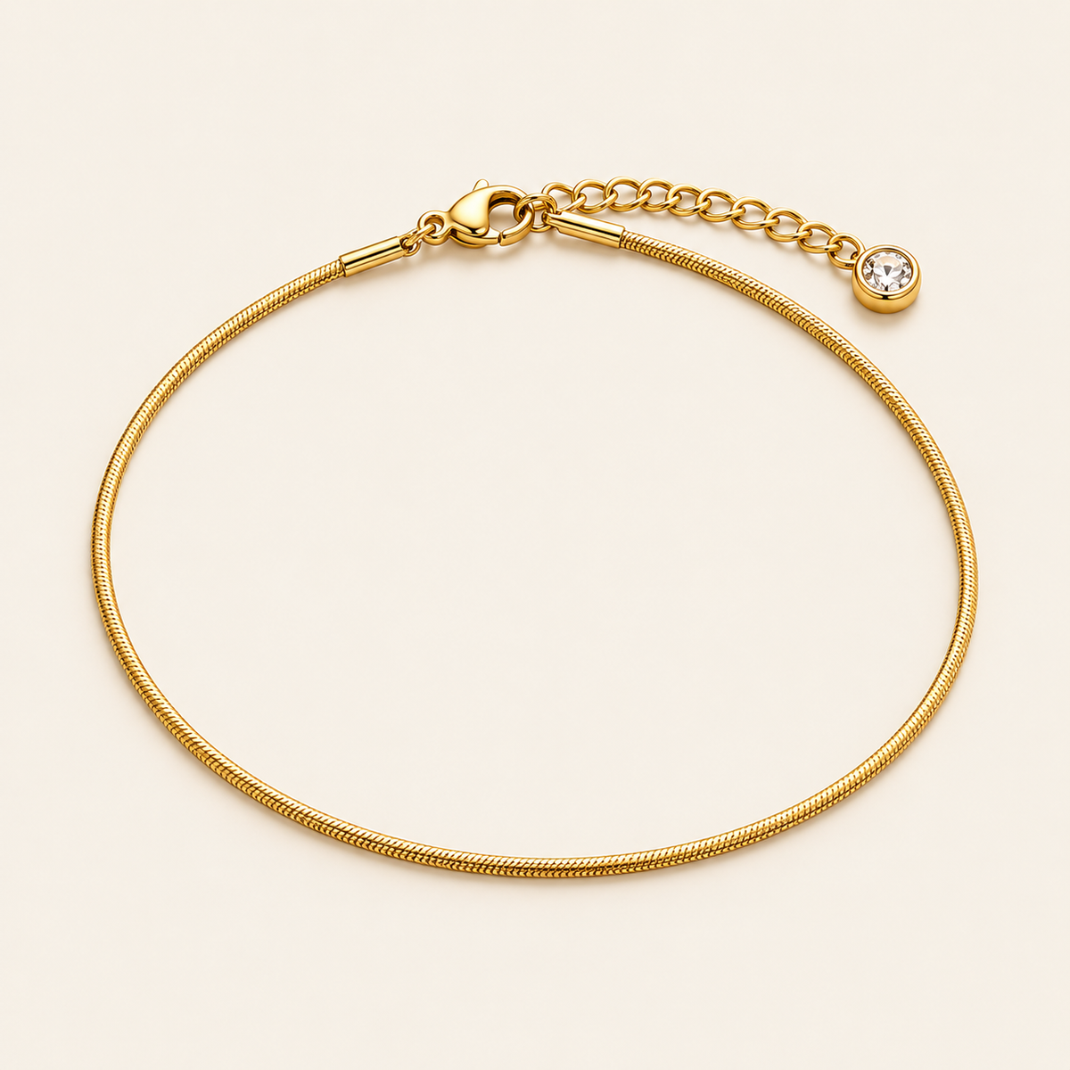 Gold Herringbone Anklet — warm ivory background