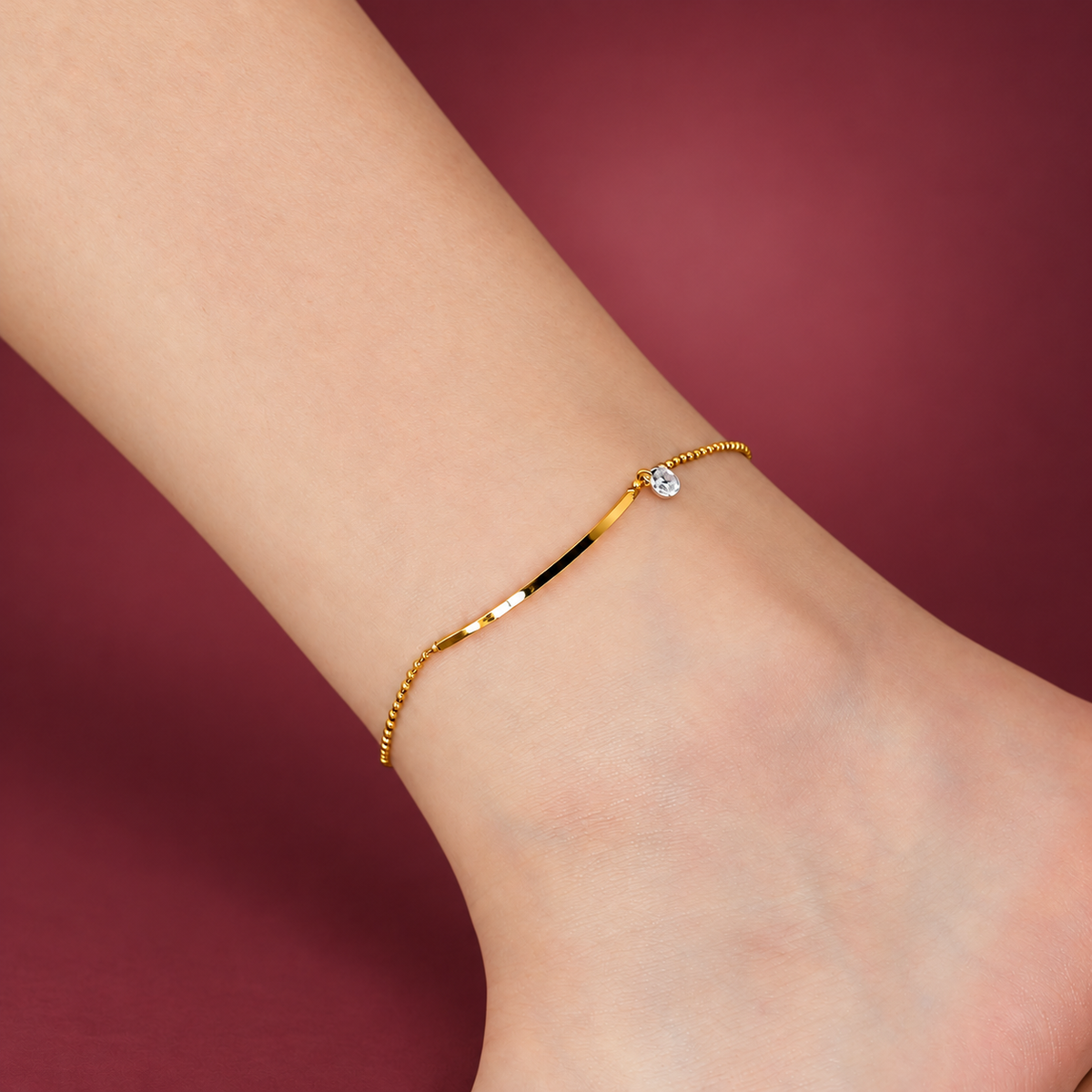 Crystal Bar Anklet — muted burgundy background