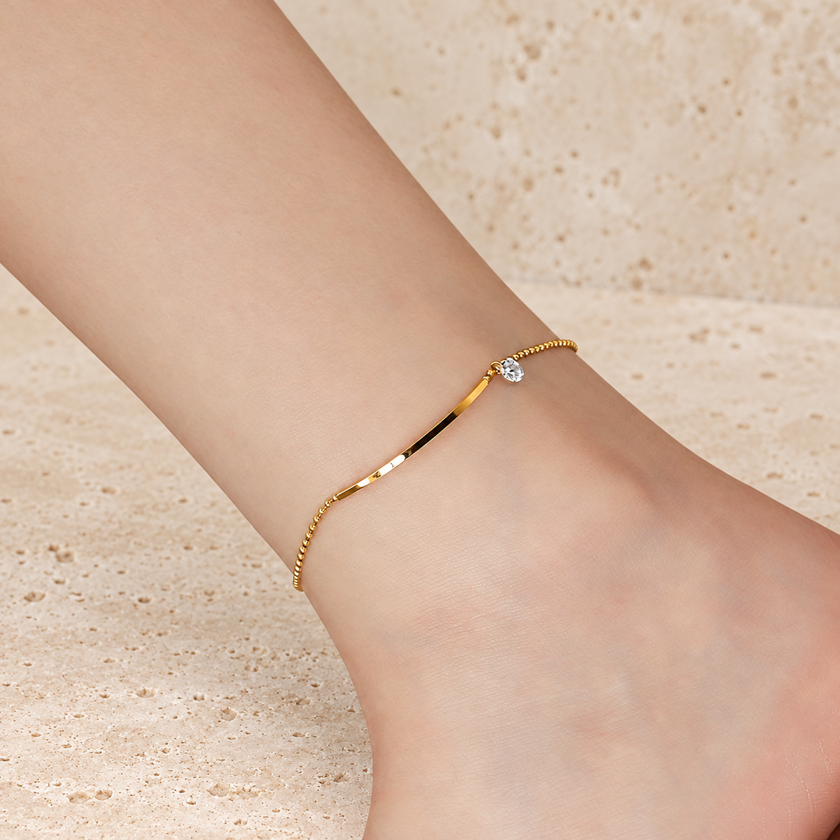 Crystal Bar Anklet — pale beige natural stone background
