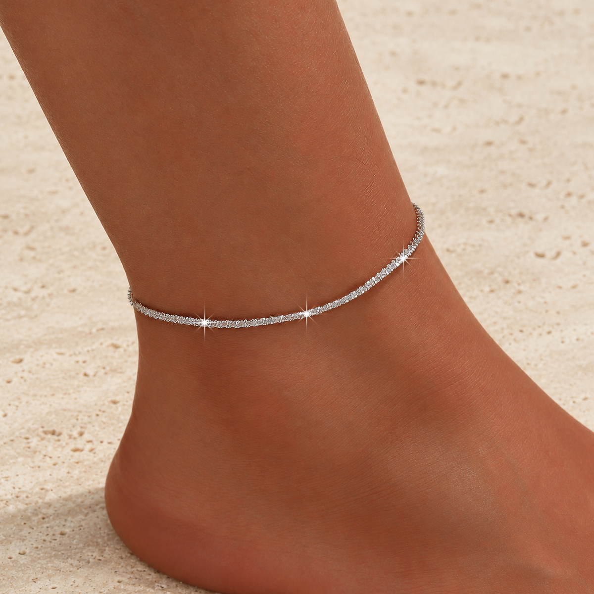 Silver Sparkle Chain Anklet — pale beige natural stone background