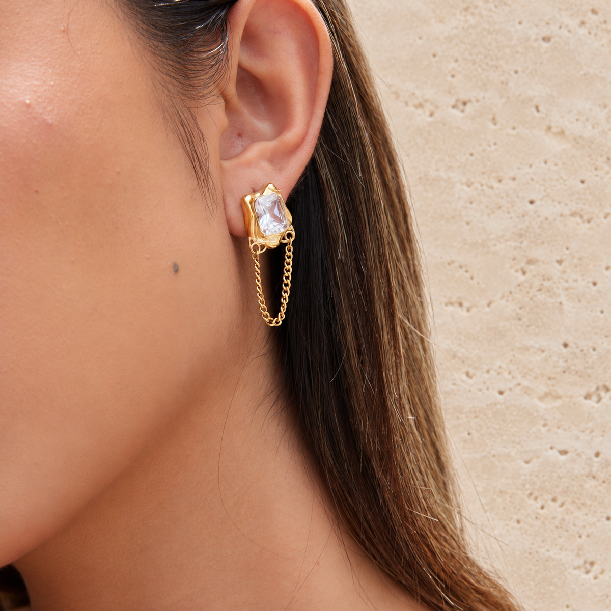 Crystal Chain Drop Earring — pale beige natural stone background