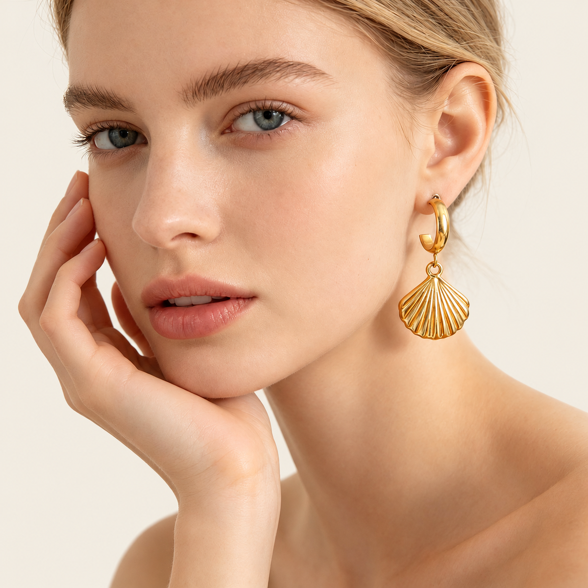 Gold Fan Shell Earring — warm ivory background