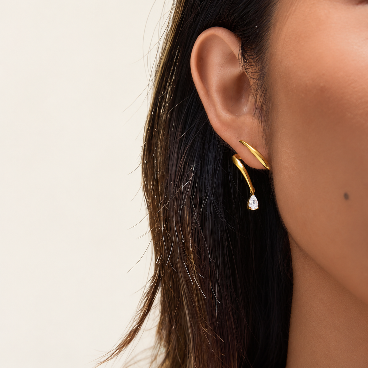 Gold Wave Crystal Earring — warm ivory background