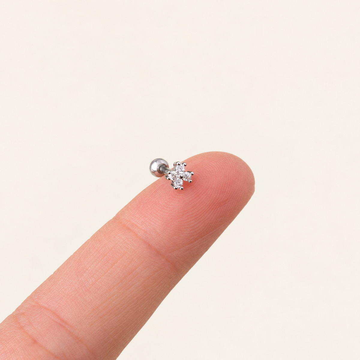 Silver Flower Cartilage Stud — warm ivory background