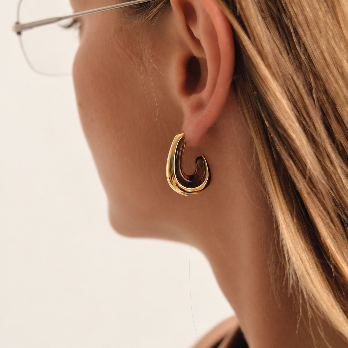 Gold Resin Hoop Earring — warm ivory background