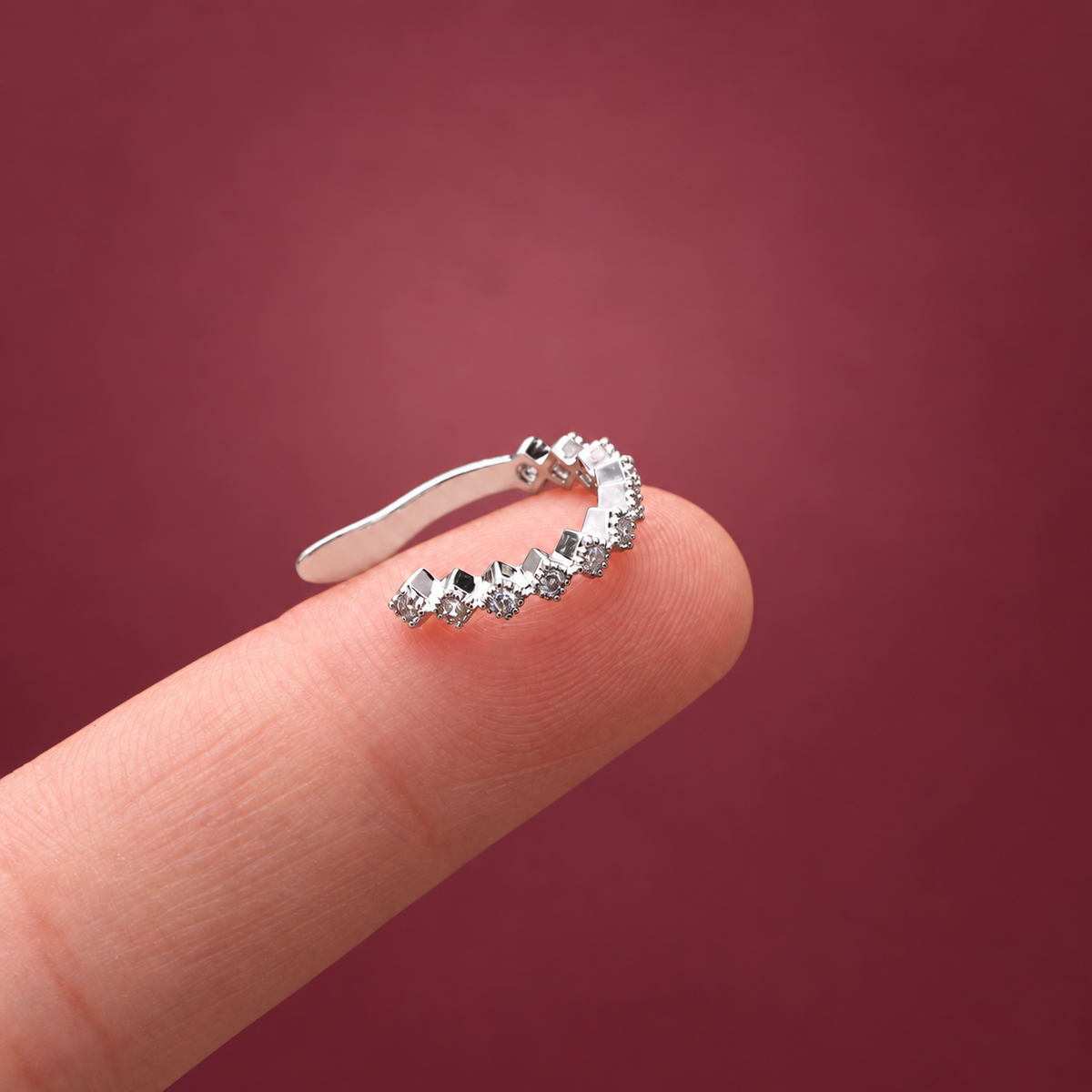 Crystal Curve Ear Cuff — muted burgundy background