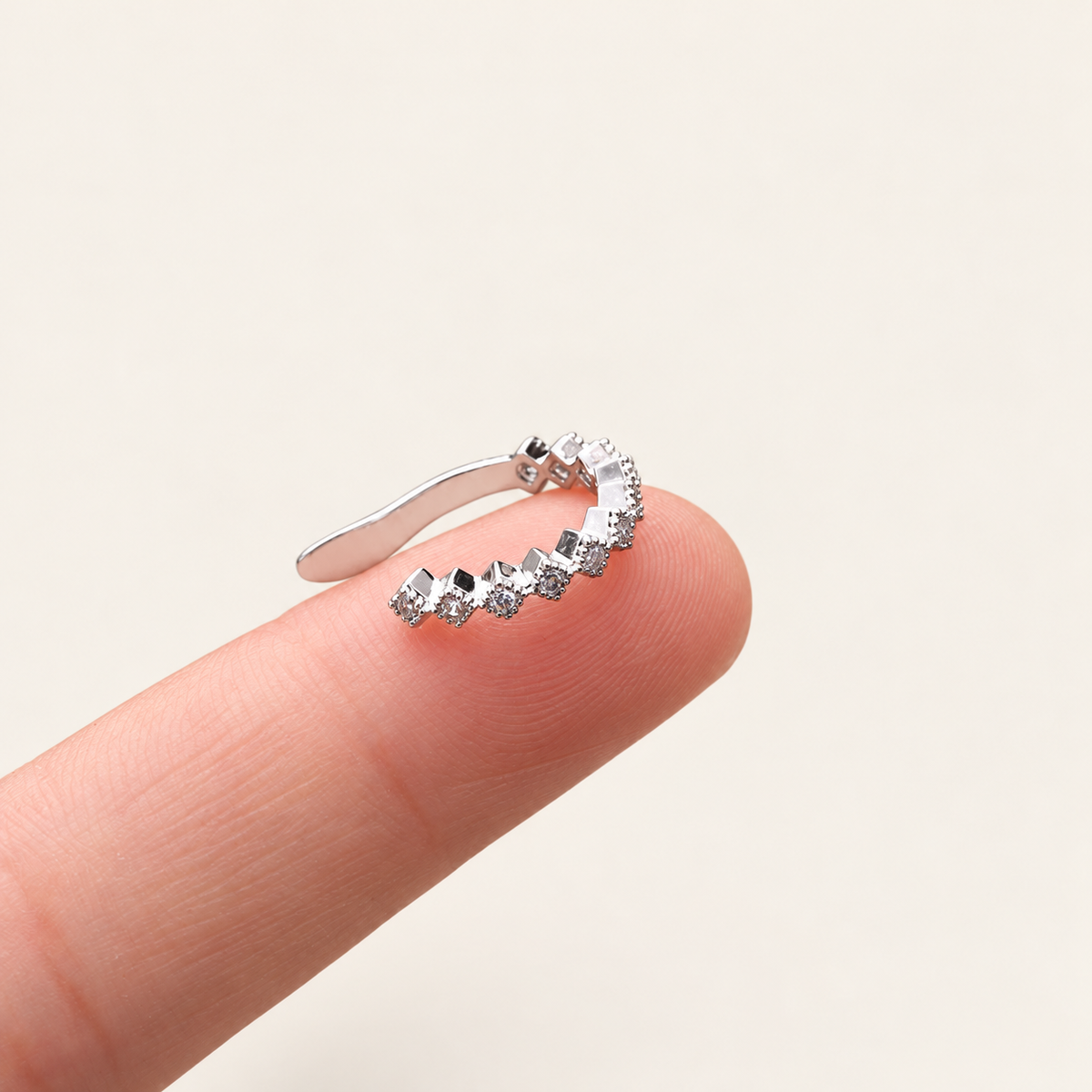 Crystal Curve Ear Cuff — warm ivory background