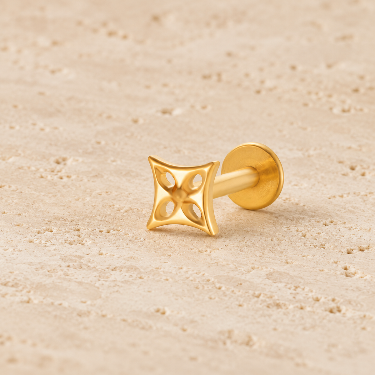 Gold Geometric Cartilage Stud — pale beige natural stone background