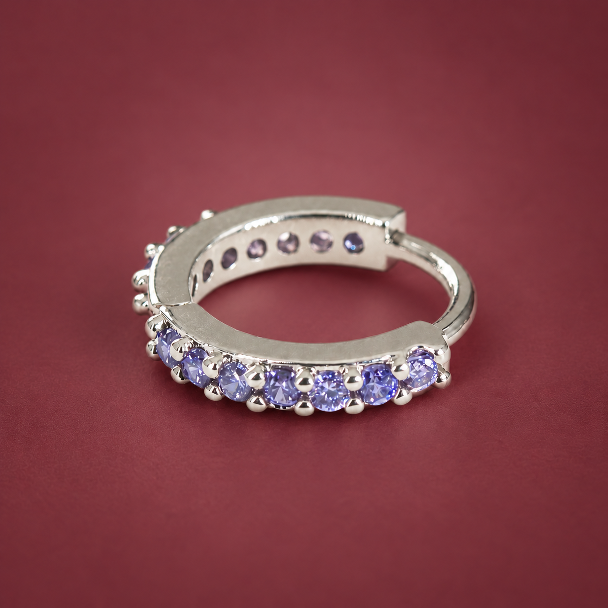 Purple Crystal Ear Cuff — muted burgundy background