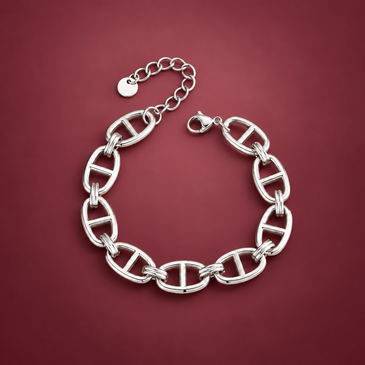 Silver-Tone Oval Link Bracelet — muted burgundy background