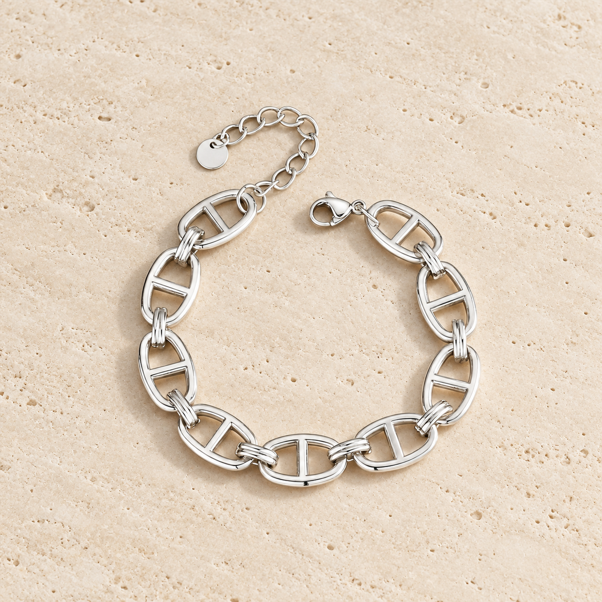 Silver Oval Link Bracelet — pale beige natural stone background