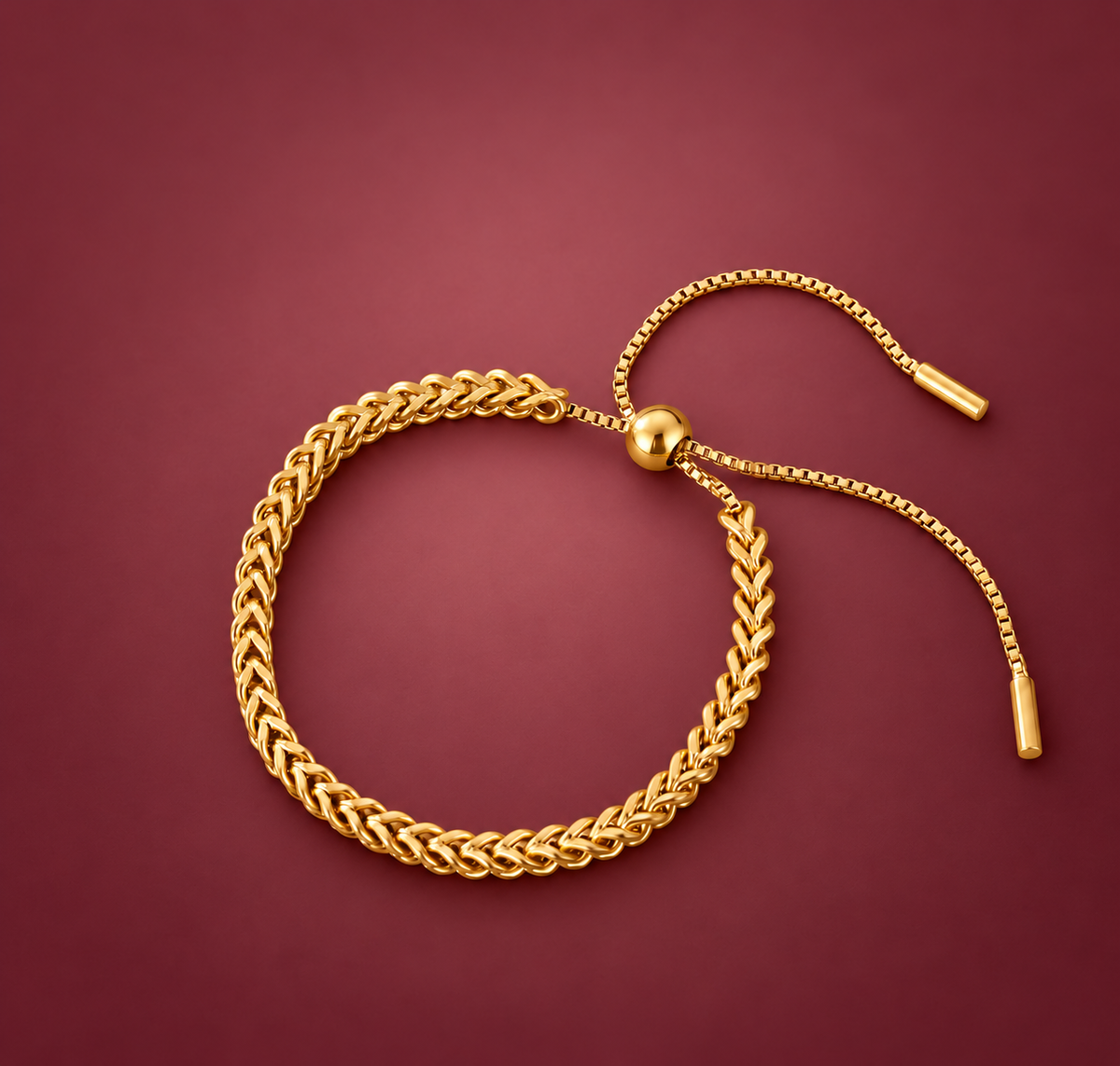 Gold-Tone Adjustable Wheat Chain Bracelet — muted burgundy background