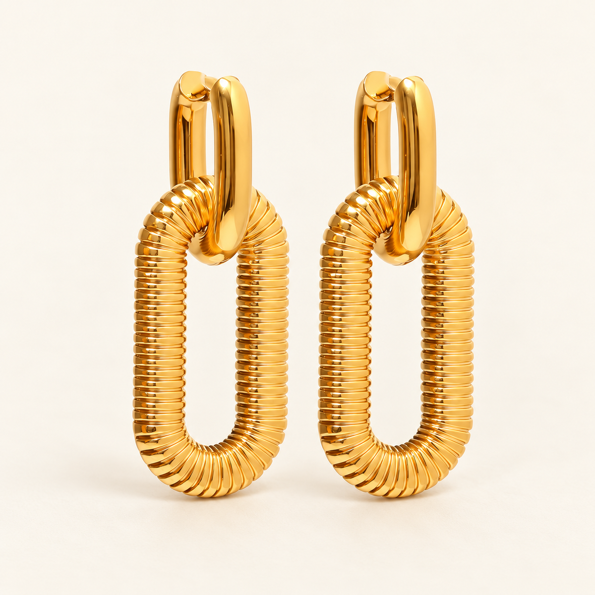 Oval Glow Earrings — gold-tone ribbed oval drop earrings