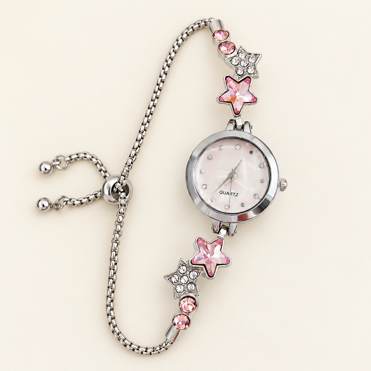 Stella Star Charm Watch — warm ivory background
