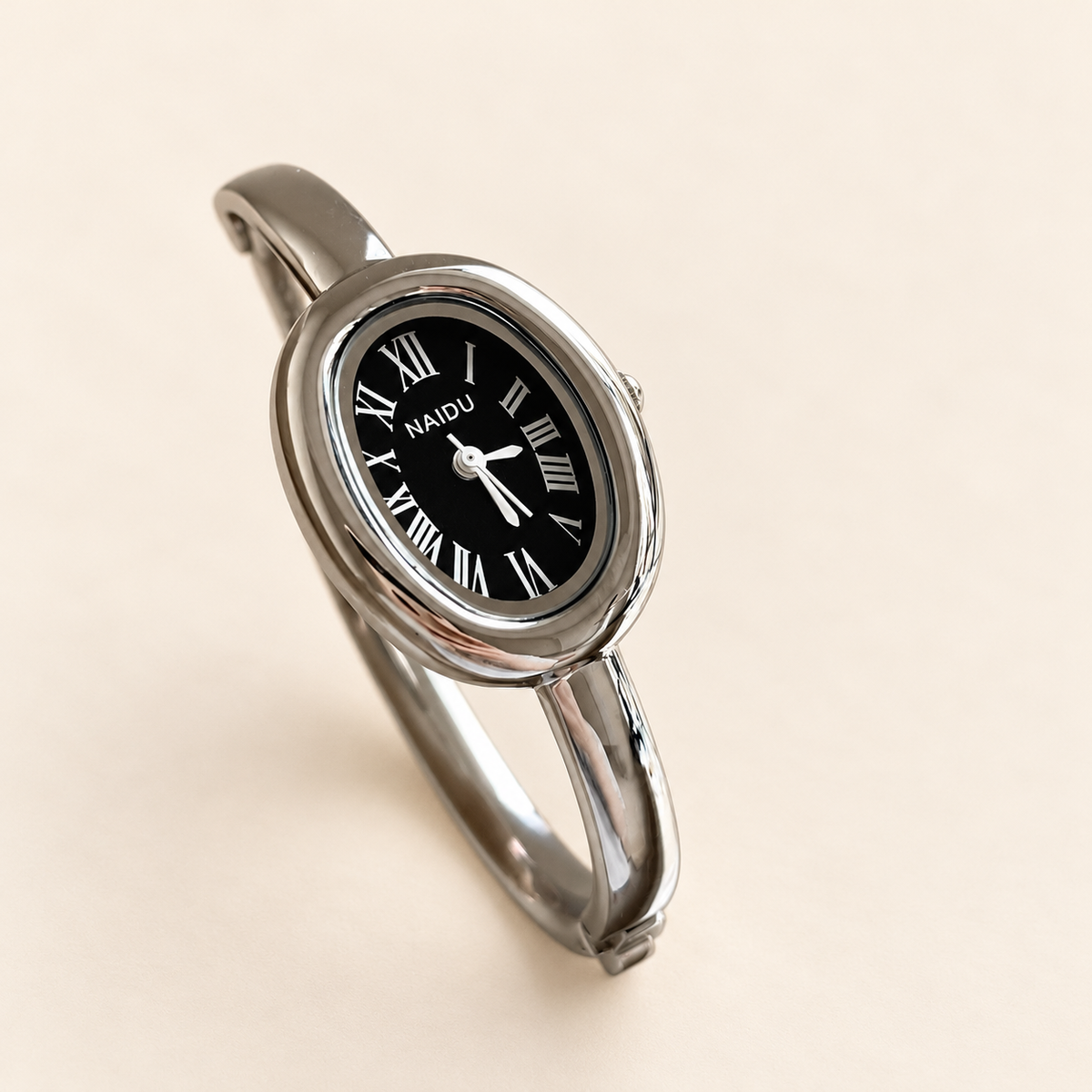 Luna Oval Silver Cuff Watch — warm ivory background