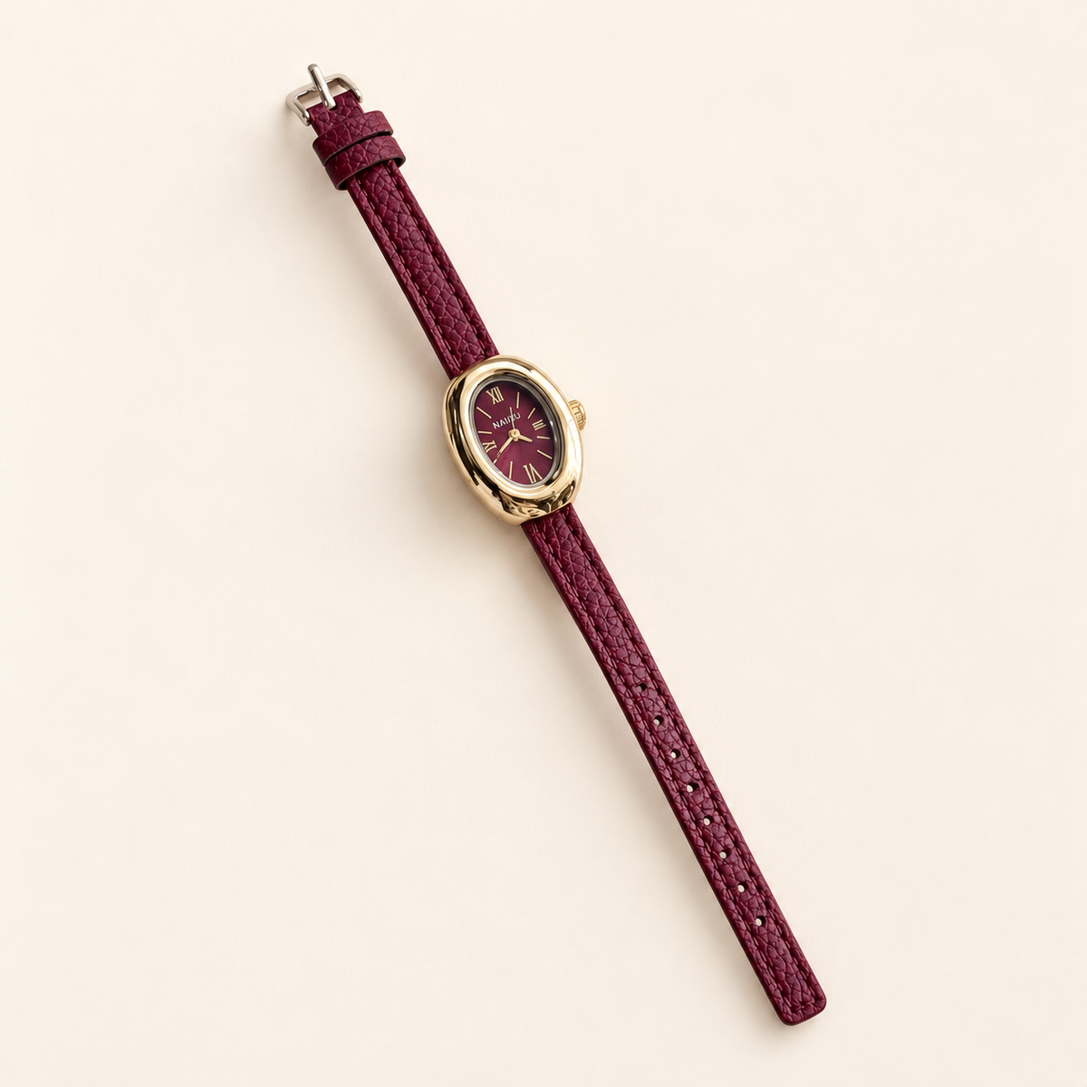 Merlot Mini Oval Watch — warm ivory background