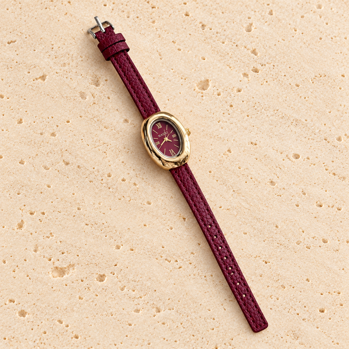 Merlot Mini Oval Watch — pale beige natural stone background