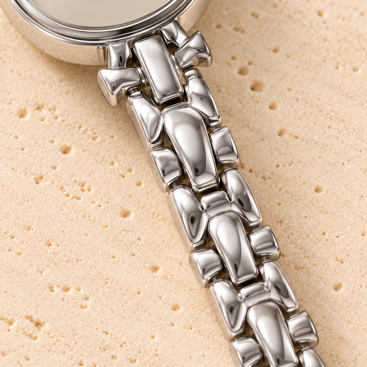 Silver Lace Oval Watch — bracelet detail — pale beige natural stone background