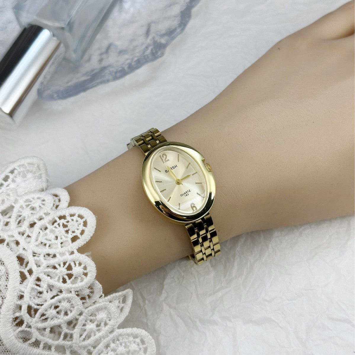 Halo Oval Link Watch — Gold-tone / Light Dial